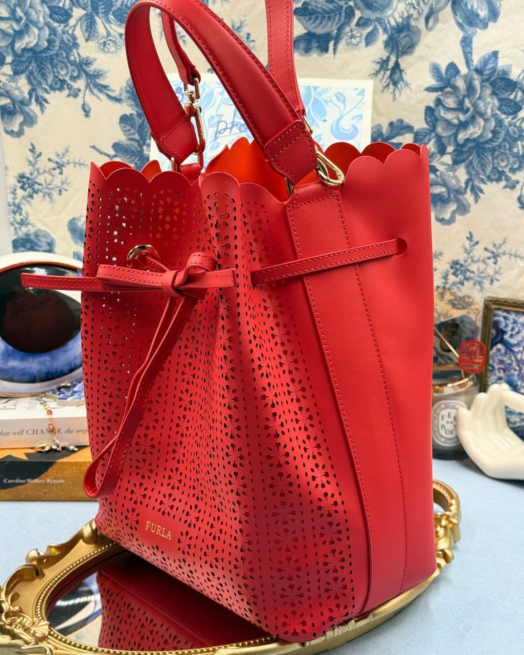Side view of FURLA Constanza Red Leather Bucket Bag
