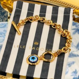 LELE SADOUGHI striped pouch included with Evil Eye Charm Bracelet