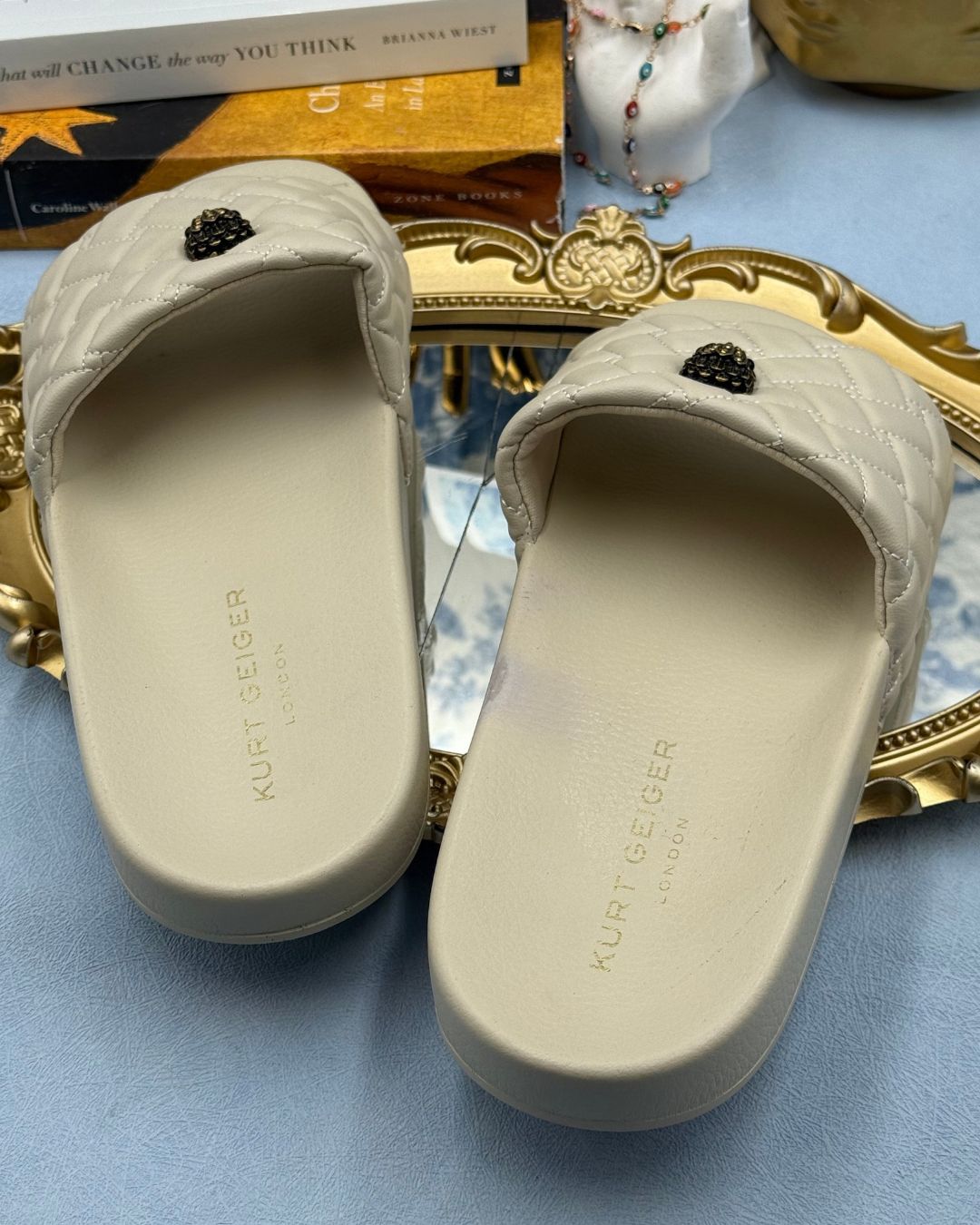 Insole & branding of KURT GEIGER LONDON Meena Eagle Quilted Pool Slides in Bone