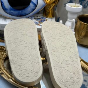 Sole of KURT GEIGER LONDON Meena Eagle Quilted Pool Slides in Bone