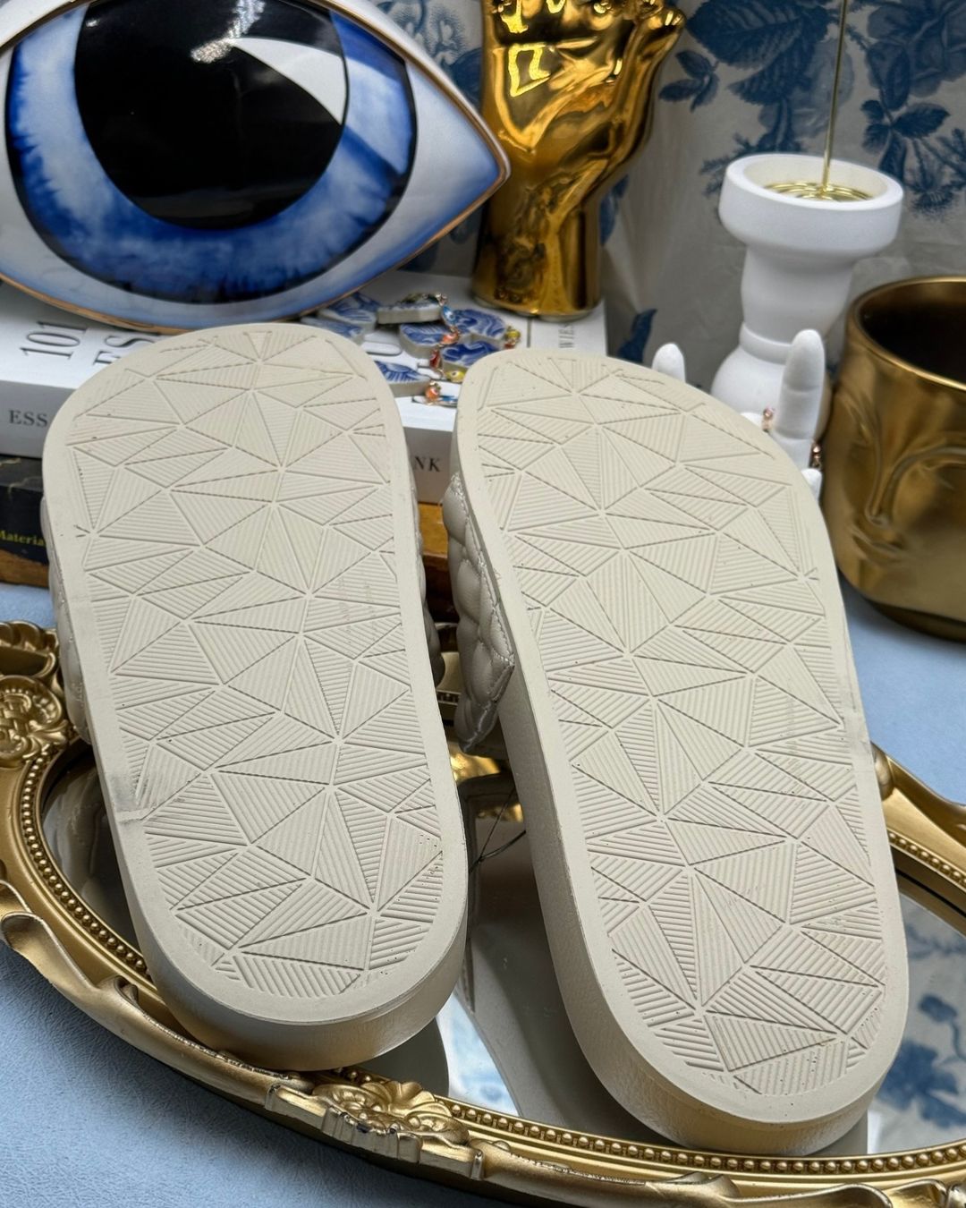 Sole of KURT GEIGER LONDON Meena Eagle Quilted Pool Slides in Bone
