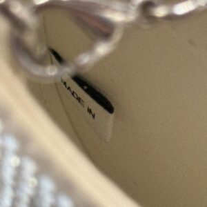 SELF-PORTRAIT made in tag inside crystal-embellished crescent bow bag