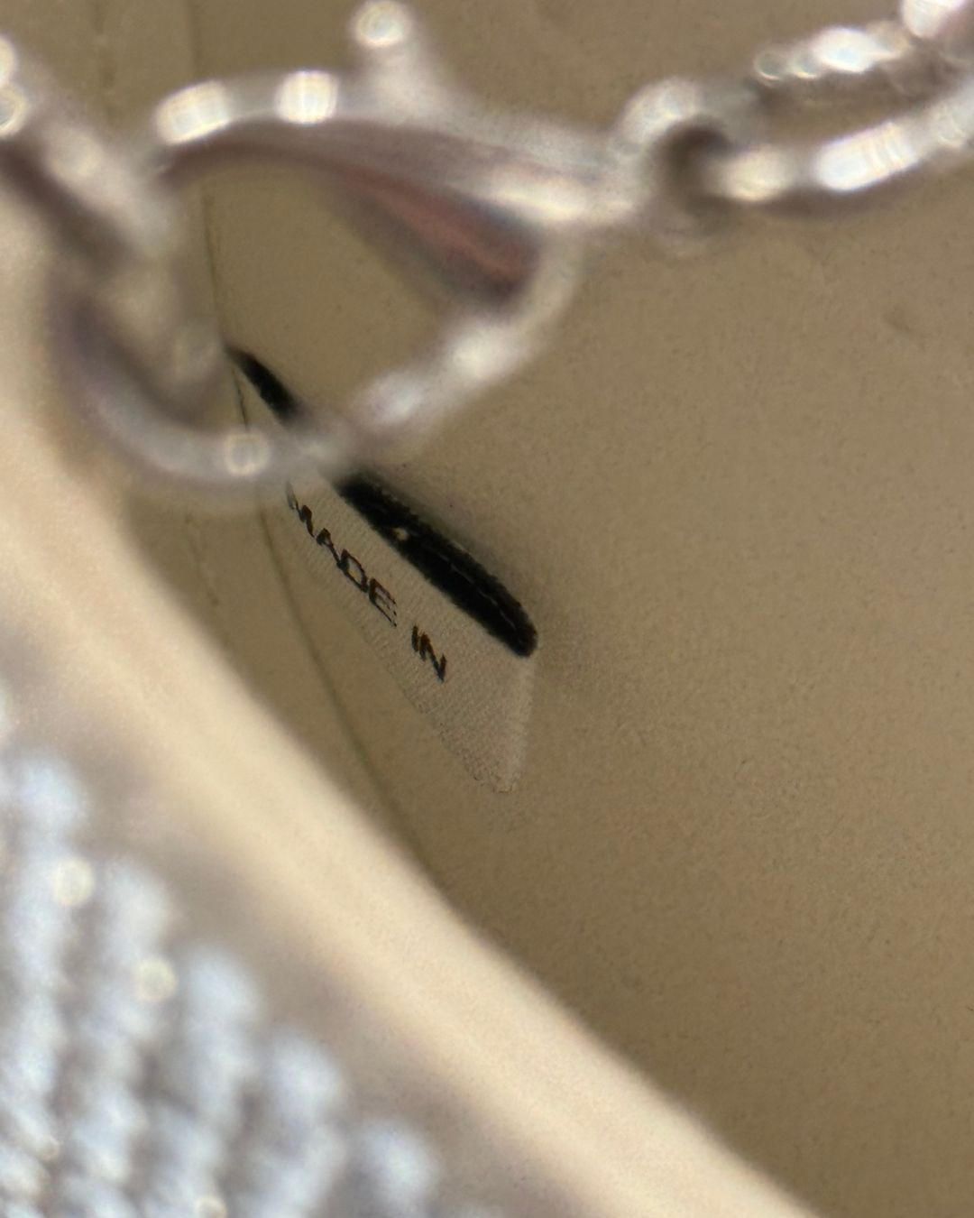 SELF-PORTRAIT made in tag inside crystal-embellished crescent bow bag