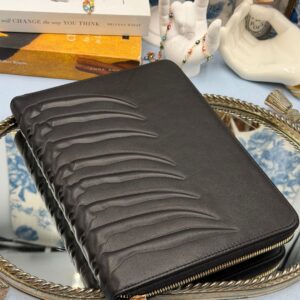 Back, embossed ribcage detail along ALEXANDER McQUEEN black leather portfolio