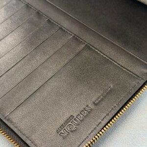 Made In & Logo Embossed inside ALEXANDER McQUEEN Skull embossed black leather portfolio with gold-tone hardware