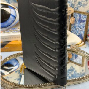 Embossed ribcage detail along ALEXANDER McQUEEN black leather portfolio