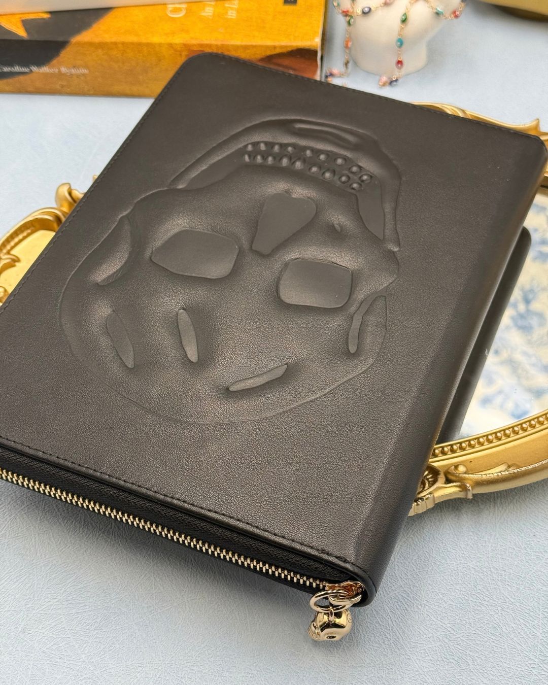 ALEXANDER McQUEEN Skull embossed black leather portfolio with gold-tone hardware