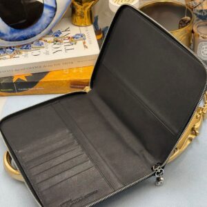 Interior of ALEXANDER McQUEEN Skull embossed leather portfolio with silver-tone hardware
