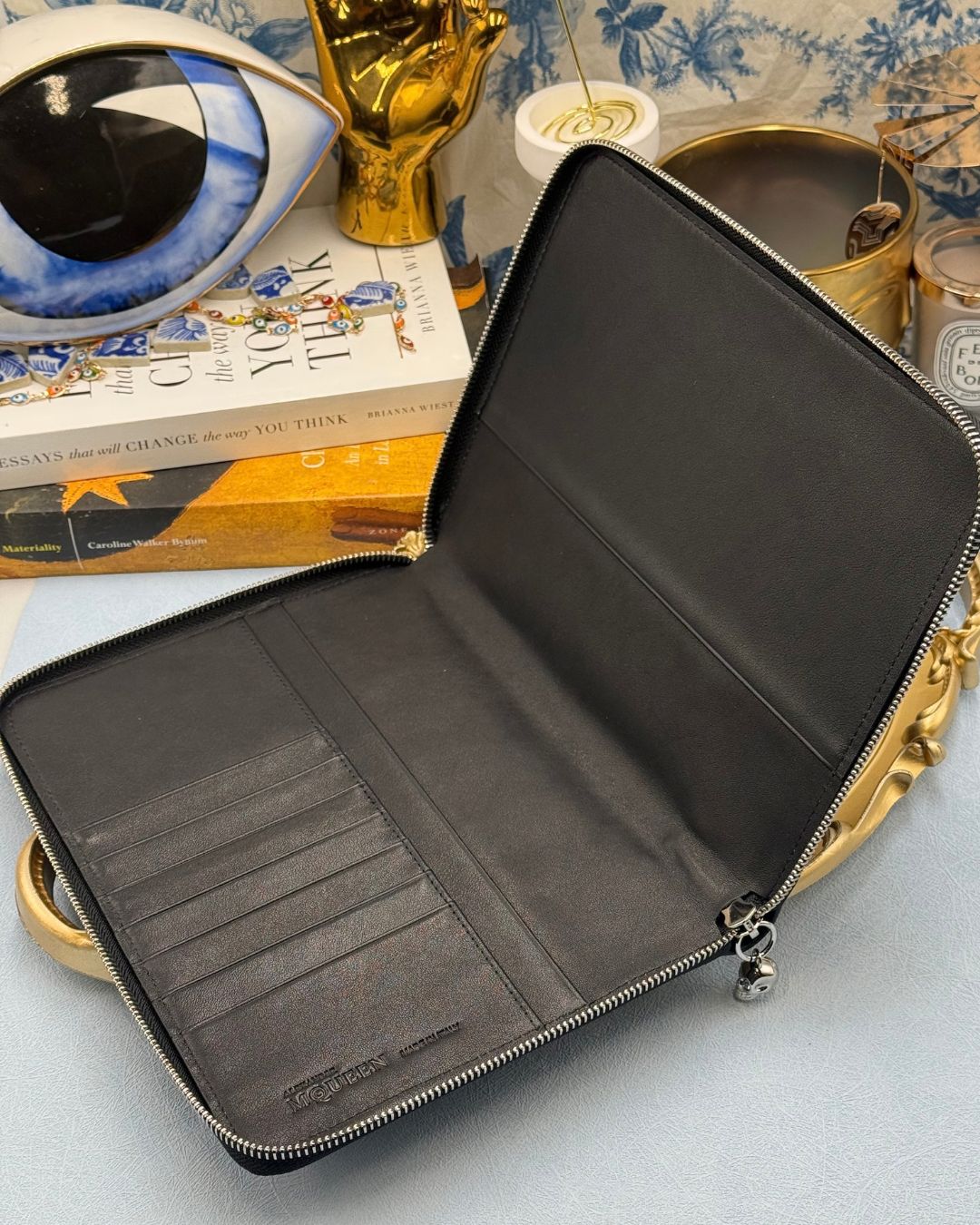 Interior of ALEXANDER McQUEEN Skull embossed leather portfolio with silver-tone hardware