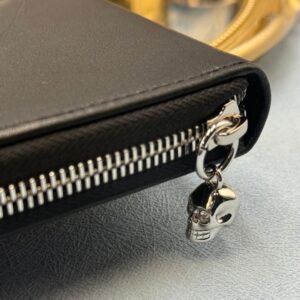 Crystal skull detail on ALEXANDER McQUEEN black leather portfolio