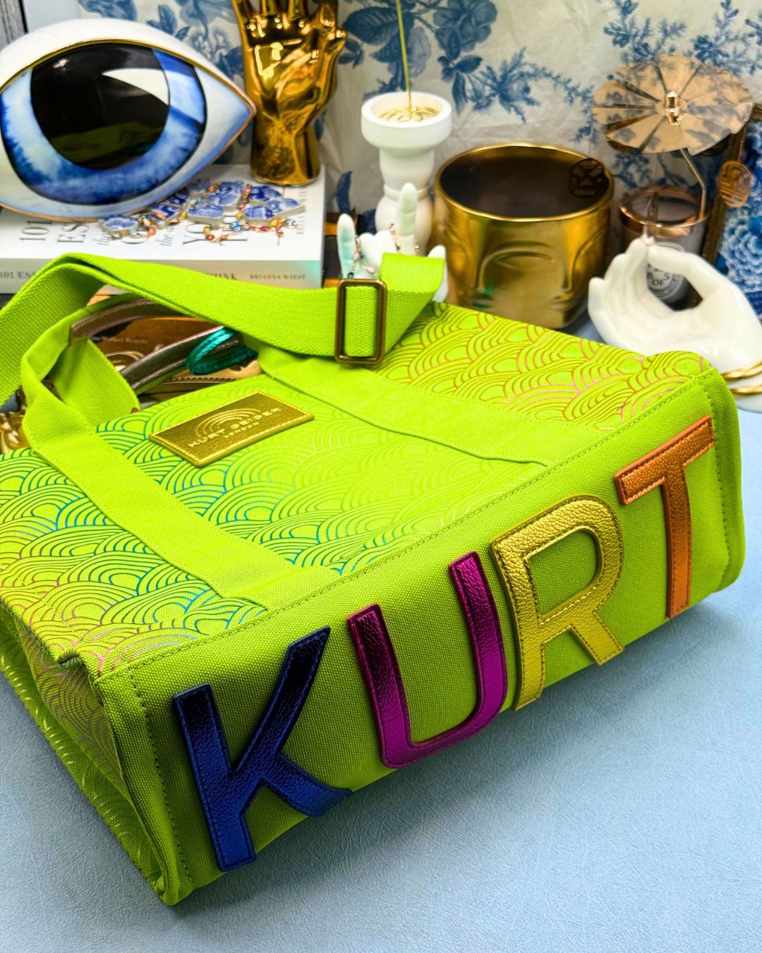 Base of KURT GEIGER LONDON Southbank Tote Bag in lime canvas with rainbow print