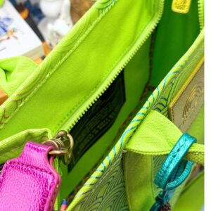 Interior view of KURT GEIGER LONDON Southbank Tote Bag in lime canvas with rainbow print