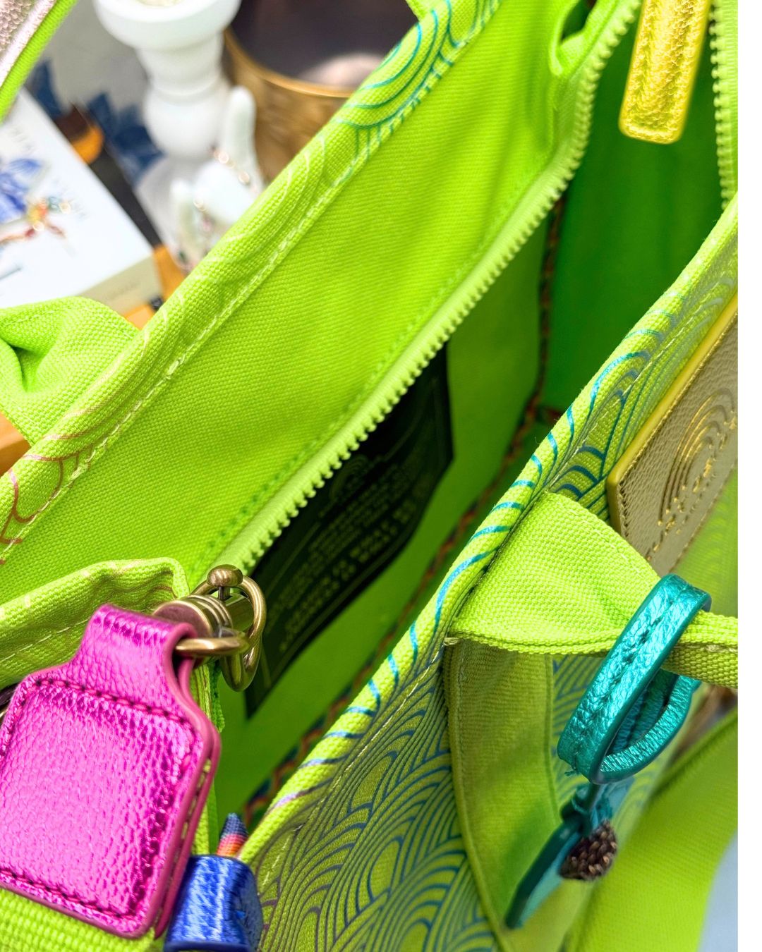Interior view of KURT GEIGER LONDON Southbank Tote Bag in lime canvas with rainbow print