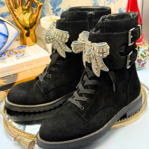 Side view of KURT GEIGER LONDON Sutton Bow Boots in black suede with crystal bows