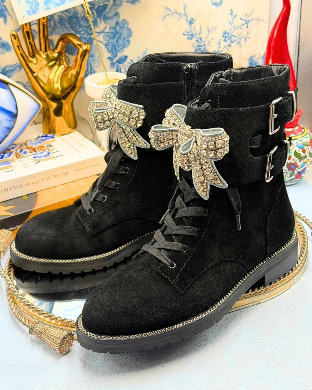 Side view of KURT GEIGER LONDON Sutton Bow Boots in black suede with crystal bows